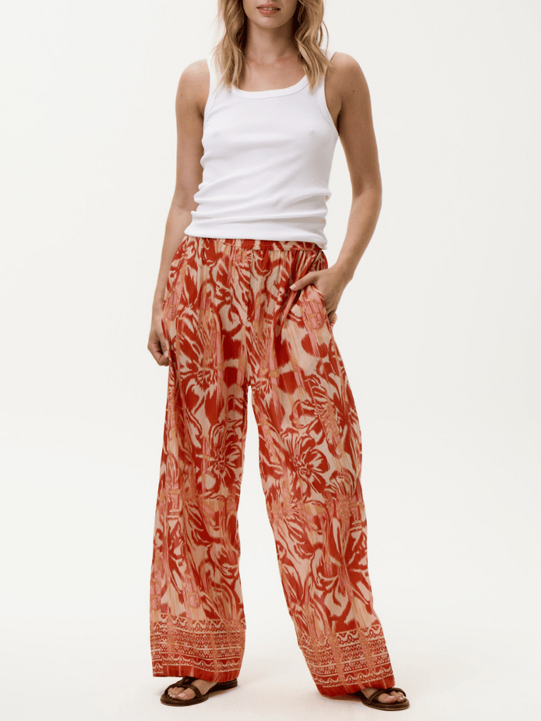 Oneseason Long Relaxed Isla Pant in Red and Orange Print Oneseason One Season lightweight and stylish resort wear Australian fashion label official stockist Signature of Double Bay